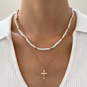 YienDoo Boho Layered Cross Choker Necklace Chain Vintage Gold Cross Pendant Necklace White Beads Strand Necklace Statement Cross Beads Necklace Charm Jewellery for Women Girls
